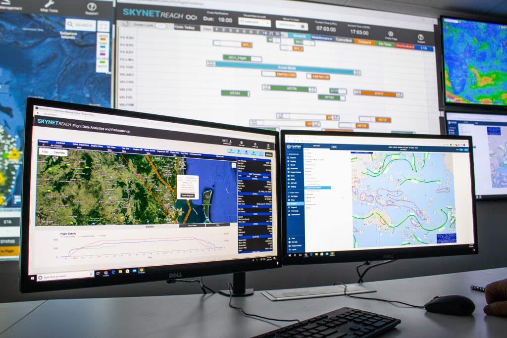 SkyNet Aviation Operations Control Centre Training room: An Airline Operations Manager uses Reach Aero Day of Operations as a cohesive and easy to use aviation OCC dashboard for systems that include flight monitoring, dispatch, scheduling, crewing, analytics and more.